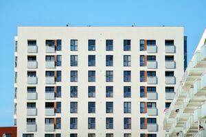 Modern apartment building in sunny day. Exterior, residential house facade. photo