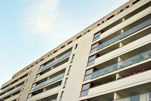 Modern apartment building in sunny day. Exterior, residential house facade. photo