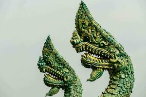 two green dragon statues photo