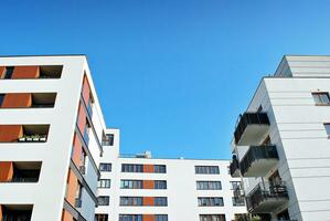 Modern apartment building in sunny day. Exterior, residential house facade. photo