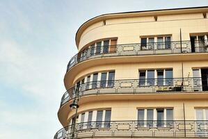 Modern apartment building in sunny day. Exterior, residential house facade. photo