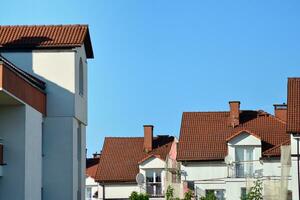 Brand new apartment building on sunny day. Modern residential architecture. Modern multi-family apartment house. photo