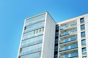 Brand new apartment building on sunny day. Modern residential architecture. Modern multi-family apartment house. photo