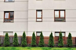 Brand new apartment building on sunny day. Modern residential architecture. Modern multi-family apartment house. photo