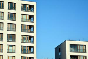 Brand new apartment building on sunny day. Modern residential architecture. Modern multi-family apartment house. photo