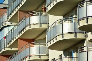 Brand new apartment building on sunny day. Modern residential architecture. Modern multi-family apartment house. photo