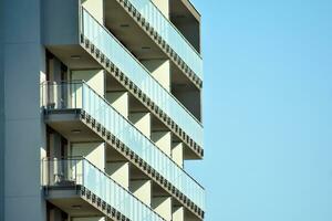 Brand new apartment building on sunny day. Modern residential architecture. Modern multi-family apartment house. photo