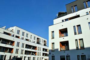 Modern apartment building in sunny day. Exterior, residential house facade. photo