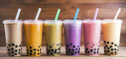 AI generated Plastic cups of different tasty bubble tea on wooden background. Generative AI photo