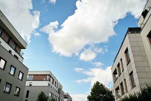 Modern apartment building in sunny day. Exterior, residential house facade. photo