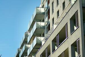 Modern apartment building in sunny day. Exterior, residential house facade. photo