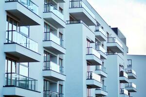 Modern apartment building in sunny day. Exterior, residential house facade. photo