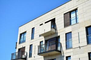 Modern apartment building in sunny day. Exterior, residential house facade. photo