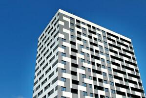 Modern apartment building in sunny day. Exterior, residential house facade. photo