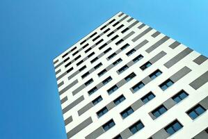 Modern apartment building in sunny day. Exterior, residential house facade. photo