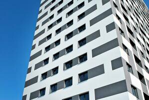 Modern apartment building in sunny day. Exterior, residential house facade. photo