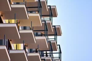 Modern apartment building in sunny day. Exterior, residential house facade. photo