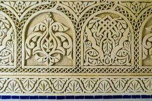 the wall is decorated with intricate carvings photo
