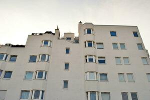 Modern apartment building in sunny day. Exterior, residential house facade. photo