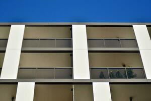 Modern apartment building in sunny day. Exterior, residential house facade. photo