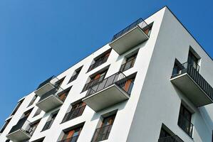 Modern apartment building in sunny day. Exterior, residential house facade. photo