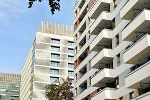 Modern apartment building in sunny day. Exterior, residential house facade. photo