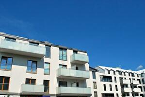 Modern apartment building in sunny day. Exterior, residential house facade. photo