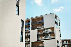 Modern apartment building in sunny day. Exterior, residential house facade. photo