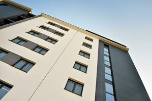 Modern apartment building in sunny day. Exterior, residential house facade. photo