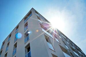 Modern apartment building in sunny day. Exterior, residential house facade. photo