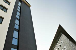 Modern apartment building in sunny day. Exterior, residential house facade. photo