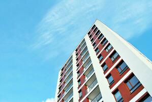 New apartment building with glass balconies. Modern architecture houses by the sea. Large glazing on the facade of the building. photo