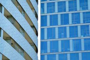 New apartment building with glass balconies. Modern architecture houses by the sea. Large glazing on the facade of the building. photo