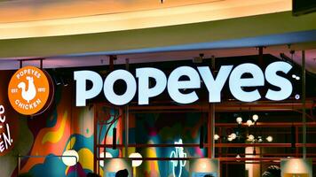 Warsaw, Poland. 5 December 2023. Sign Popeyes. Company signboard Popeyes. photo