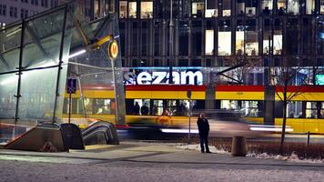 Warsaw, Poland. 5 December 2023. Modern tram waiting for green light photo