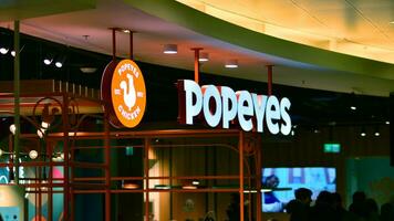 Warsaw, Poland. 5 December 2023. Sign Popeyes. Company signboard Popeyes. photo