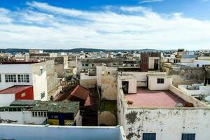 the rooftops of a city with many buildings photo