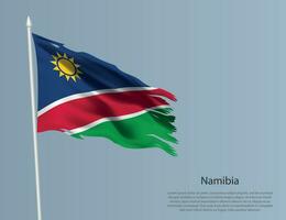 Ragged national flag of Namibia. Wavy torn fabric on blue background vector