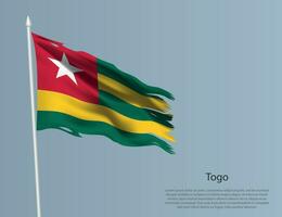 Ragged national flag of Togo. Wavy torn fabric on blue background vector