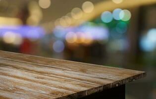 Empty wood table top and blur of out door garden background Empty wooden table space for text marketing promotion. blank wood table copy space for background photo