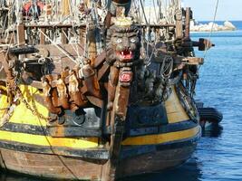 Wooden figurehead of tall ship frigate photo