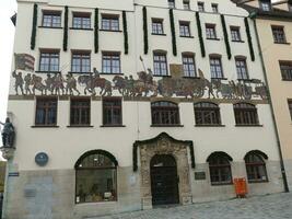 fresco of medieval merchant convoy of wagons and knights Nuremberg photo