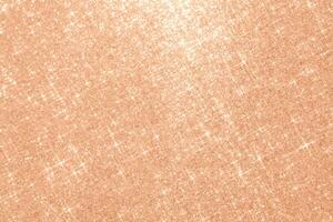 Abstract Peach Fuzz background with sparkles in the shape of stars. photo