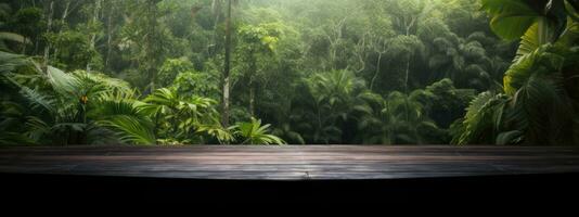 burnt wood table for product presentation. against the background of palm trees and various tropical jungle plants photo