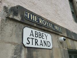 el real milla y abadía hebra calle firmar en Edimburgo foto