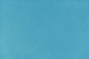 Texture background of cyan velours fabric textured like leather surface photo