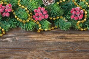 Christmas fir tree with decoration wooden background photo