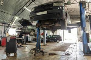 Cars in automobile repair service center. photo