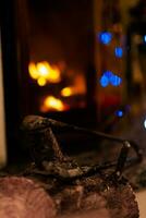 Fire in a fireplace in the living room with accessories photo