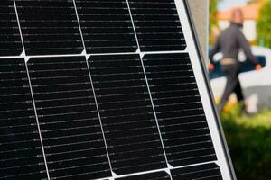 Solar panels on a well-exposed wall of an individual house, making savings following the energy crisis, eco-citizen gesture, green energy photo